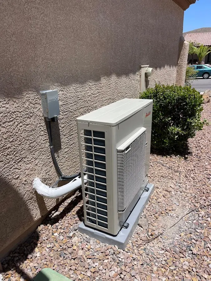 Residential air conditioning condenser unit in Millstone